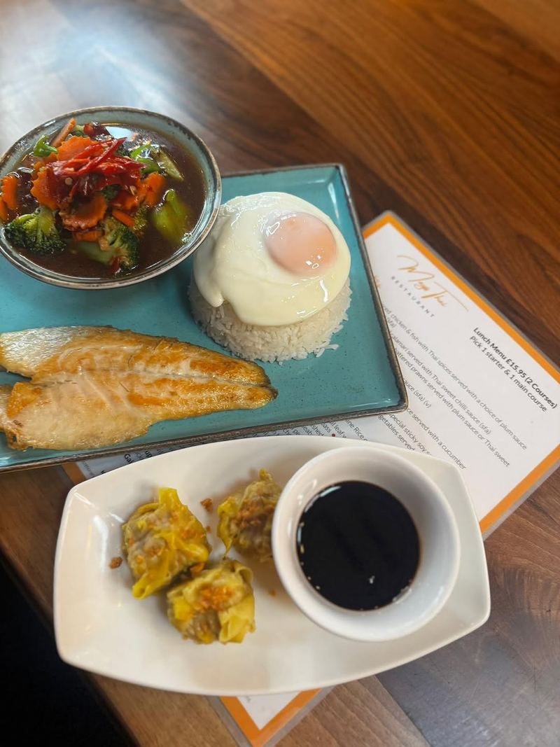 Lunch menu spread with seabass, sui mai and egg rice